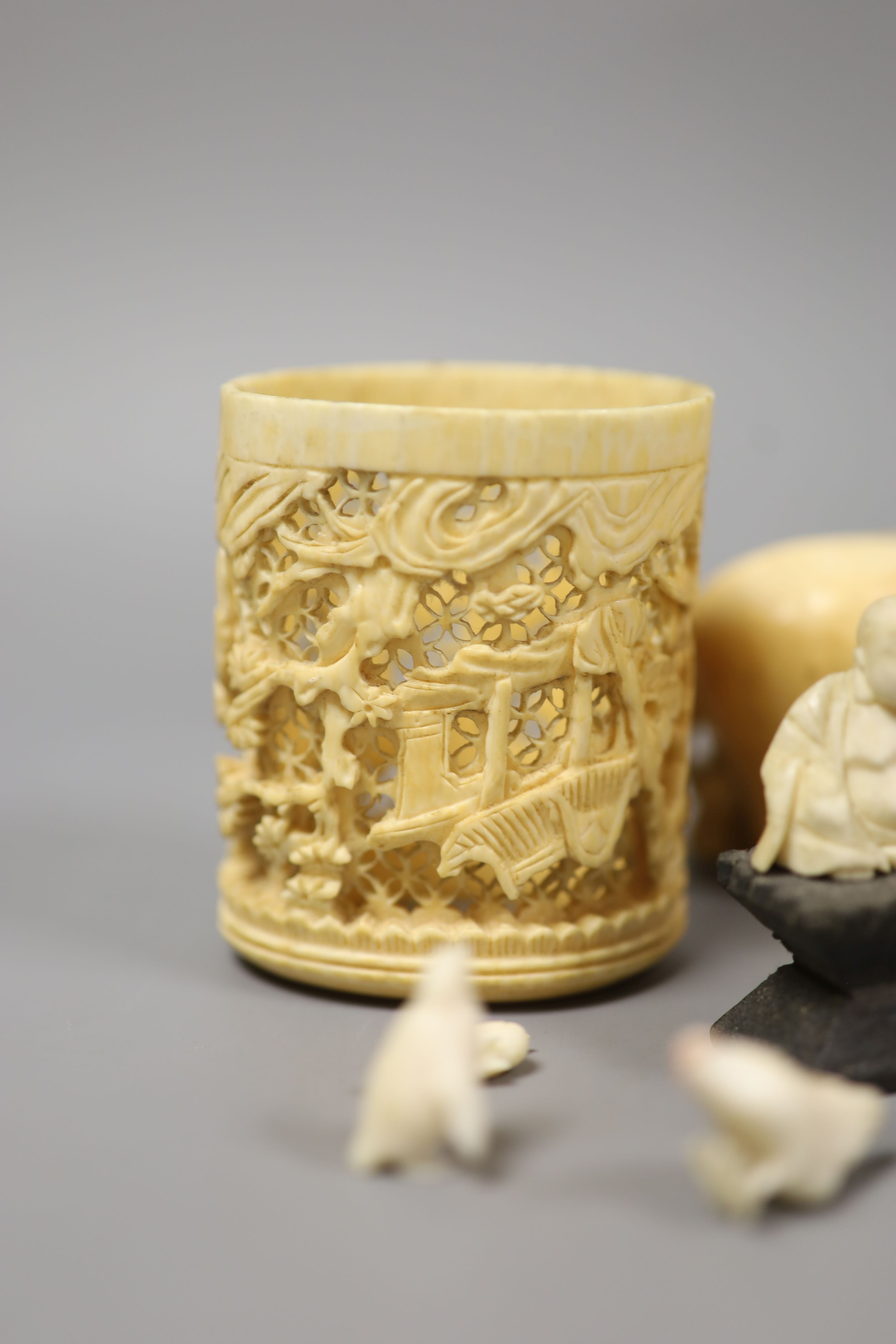 A Japanese Ivory model of a bijin, a similar model of a temple, various European Ivory models of animals and birds, an Indian Ivory figure et cetera, or late 19th or early 20th century